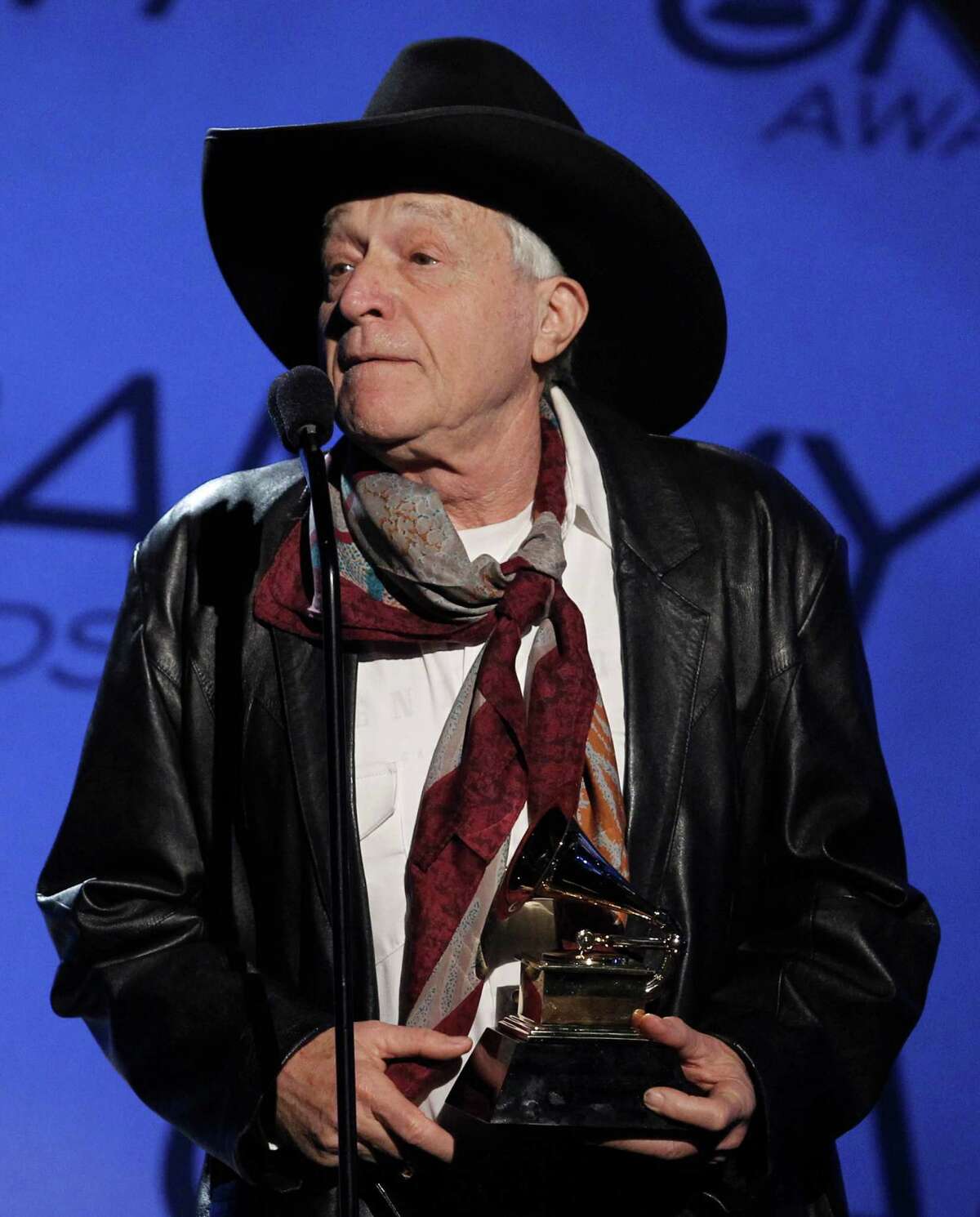 FILE - In this Sunday, Jan. 31, 2010 file photo, Ramblin' Jack Elliott accepts the award for traditional blues album for "A Stranger Here" at the Grammy Awards in Los Angeles. The revitalized Newport Folk Festival continues to expand as younger fans discover old folk stars like Elliott. (AP Photo/Matt Sayles, File) ORG XMIT: BX804