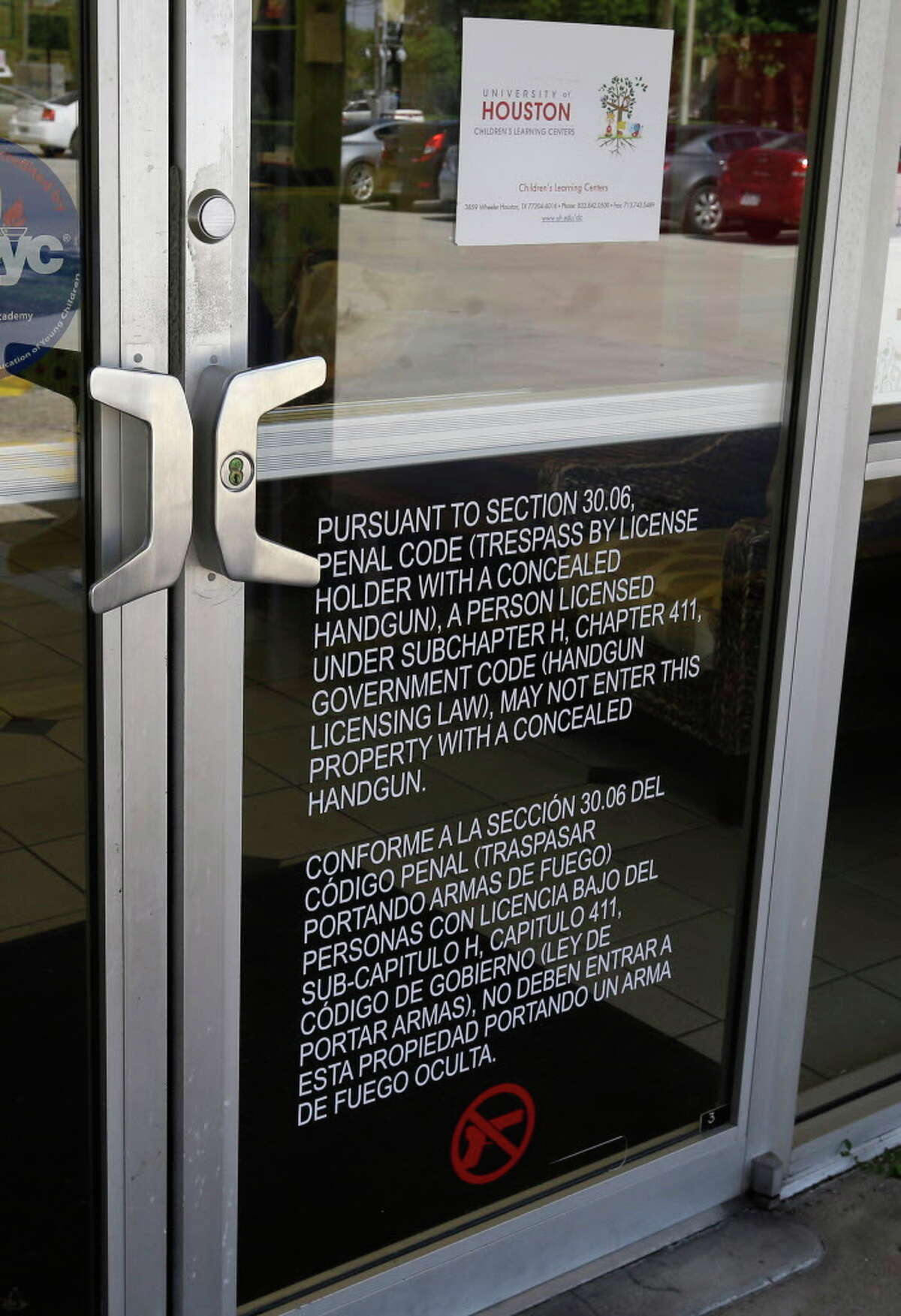 A sign on the door of the University of Houston Child Care Center, 4139 Wheeler St., states that concealed handguns are not permitted shown Monday, Aug. 1, 2016, in Houston.