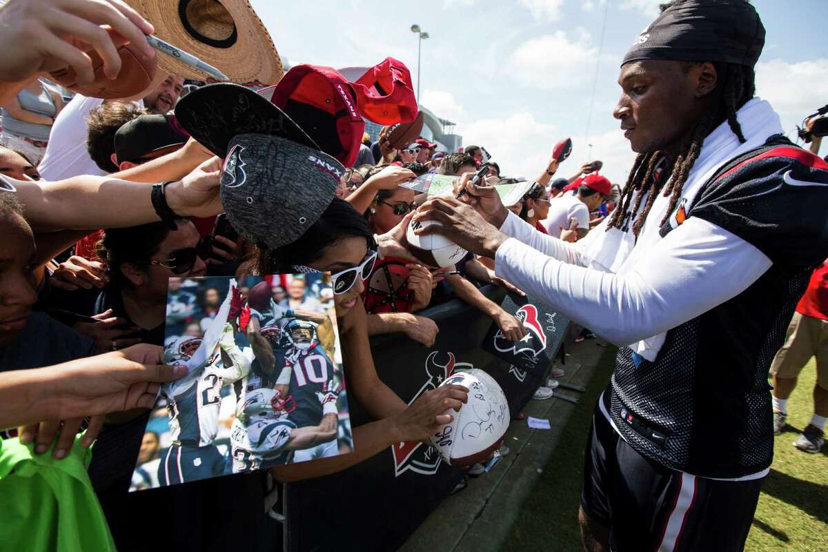 Houston Texans wide receiver DeAndre Hopkins (10) signs autographs during Texans training camp at Houston Methodist Training Center on Monday, Aug. 1, 2016, in Houston.