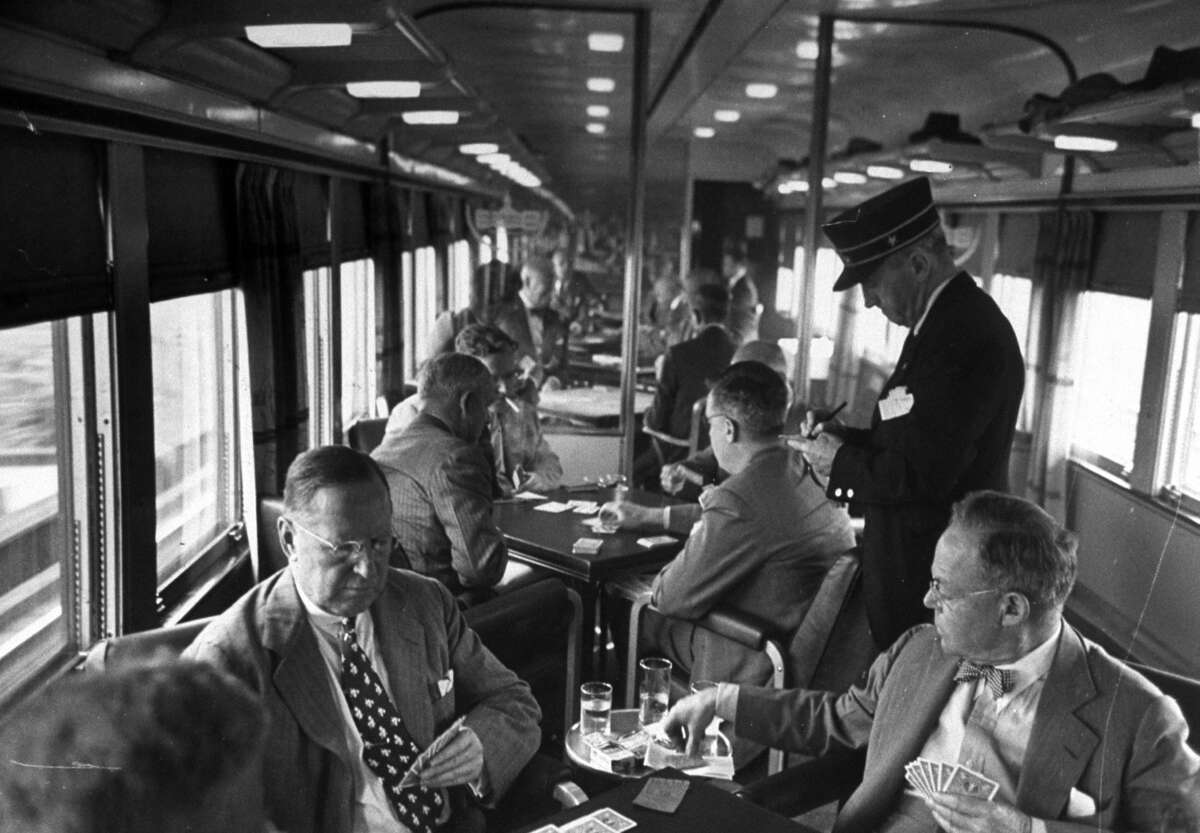 Legendary LIFE magazine photographer Peter Stackpole documented the Gold Coast Club cars and smokers filled with paper-reading, bridge-playing commuters on way home to Connecticut from business in New York City, 1948.