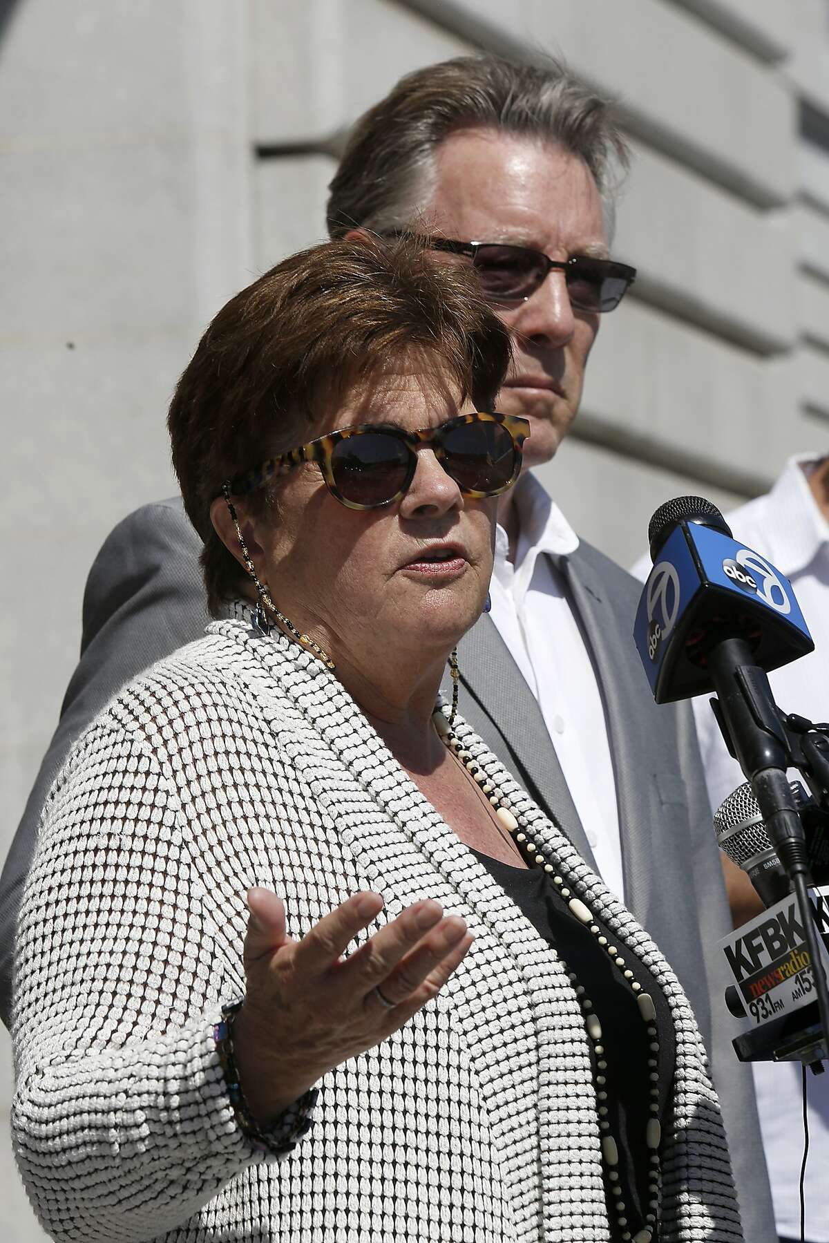 Liz Sullivan (front) and father Jim Steinle, parents of Kathryn Steinle, answer questions in front of city hall about his daughter's death in San Francisco, Calif., on Tuesday, September 1, 2015.