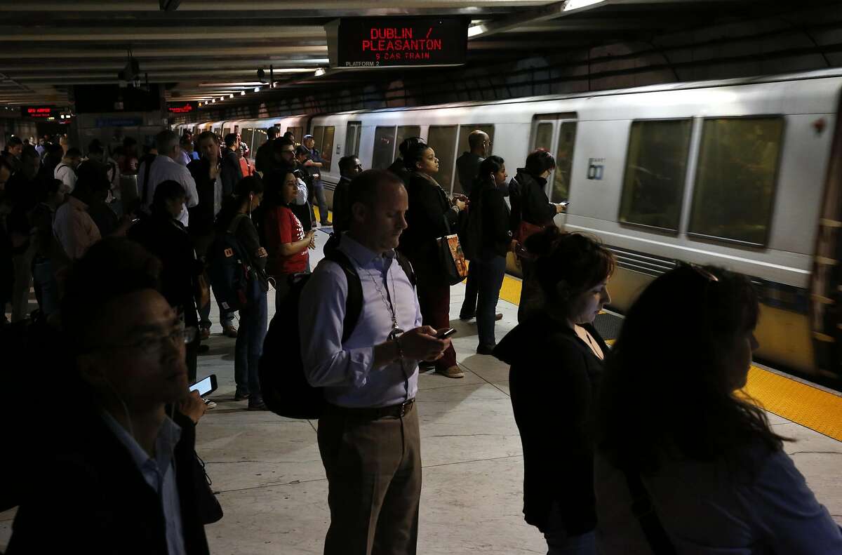 People walk and wait for a train at the Embarcadero BART station in this file photo from May 4, 2016 in San Francisco, Calif. Passengers on Tuesday saw a gaggle of Bart Simpsons ride a BART train in San Francisco.
