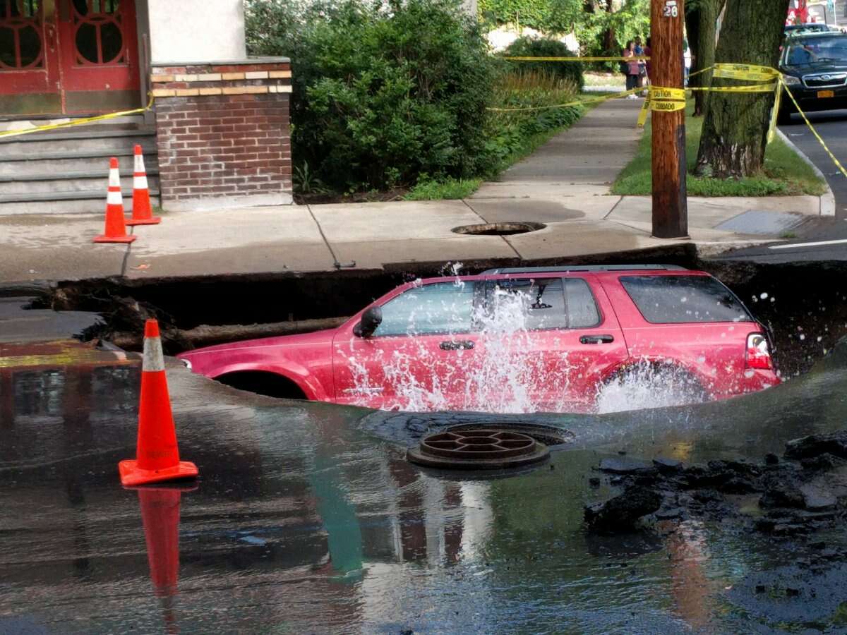 A sinkhole on Aug. 2, 2016, on South Lake Avenue where an Albany police officer said a water main leaked and is being shut down. (J.p. Lawrence/Times Union)