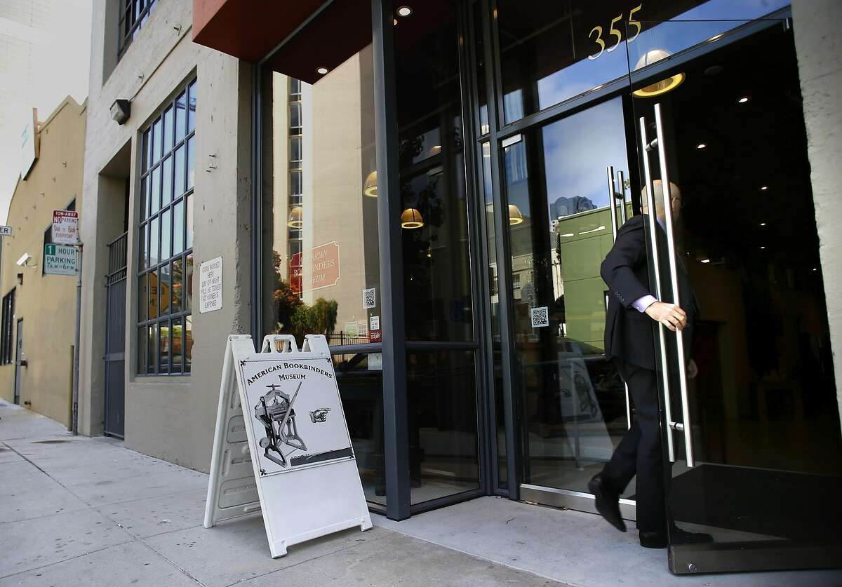 An attendee arrives for a lunchtime seminar at the American Bookbinders Museum in San Francisco, California, as seen on Tues. Aug. 2, 2016. The museum offsets the ever escalating costs of operating in the city of San Francisco by renting out their place to local businesses through Peerspace a kind of Airbnb for commercial meetings and activities.
