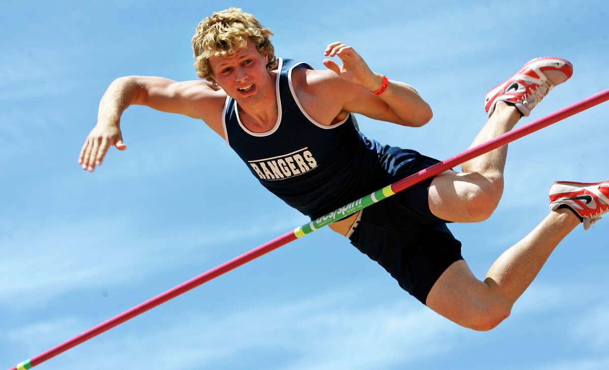 Smithson Valley's Logan Cunningham tries to squeeze over 17 feet after clearing 16'6" earlier to claim second place in the high school pole vault at the Texas Relays Friday, April 3, 2009. Tom Reel/Staff