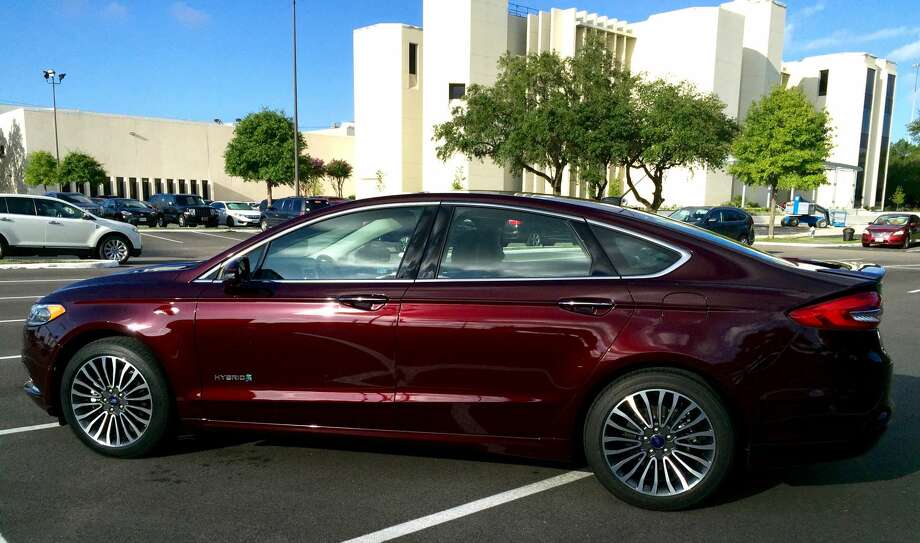 Review 2017 Ford Fusion Hybrid Anium Houston Chronicle The 2017 Ford Fusion Hybrid Anium Parked In Front Houston Chronicle Building Photo
