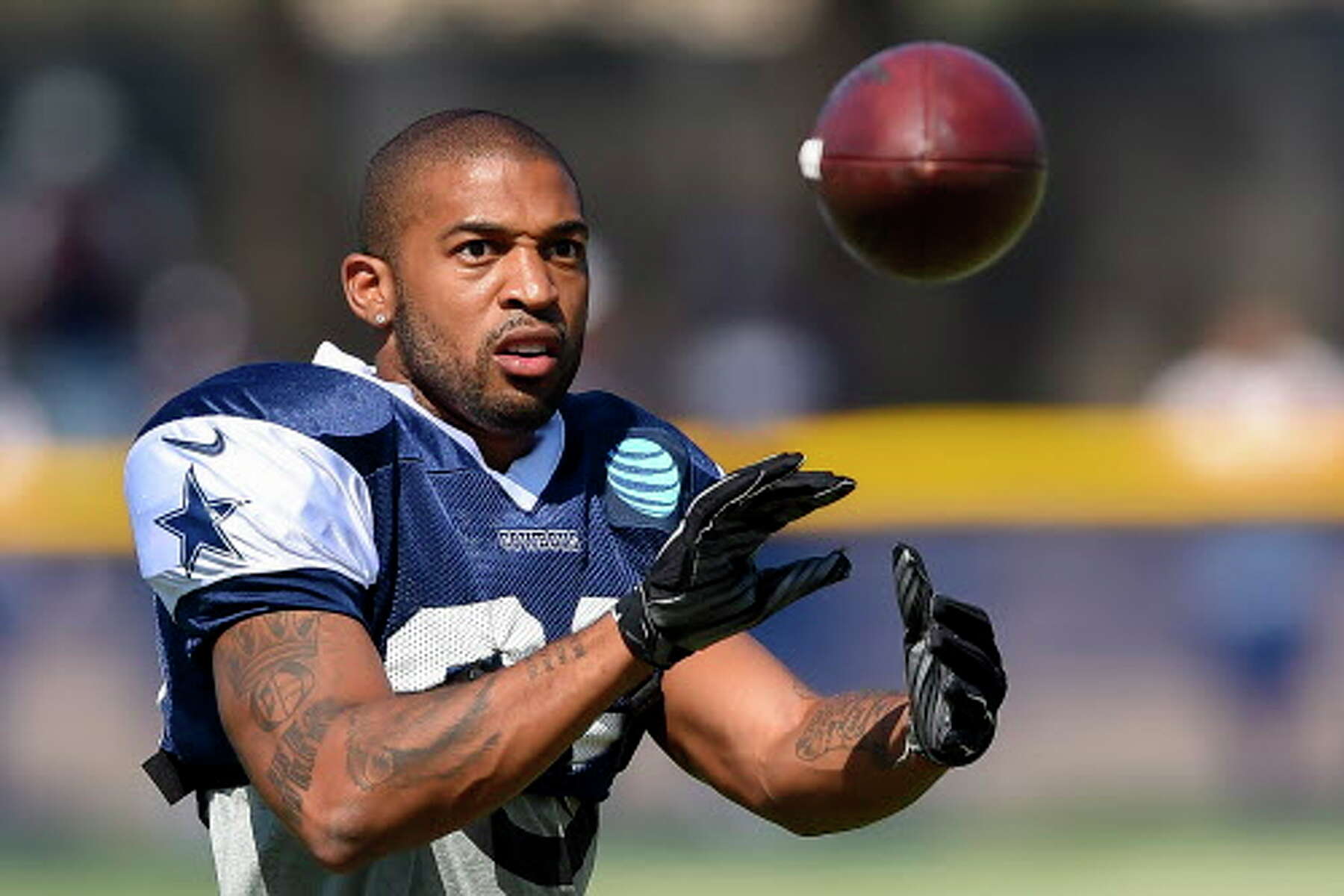 Dallas Cowboys cornerback Orlando Scandrick, left, has a discussion with  Rowdy the mascot before the Cowboys training camp at the Alamodome in San  Antonio, Texas, Thursday, July 30, 2009. (Photo by Ron