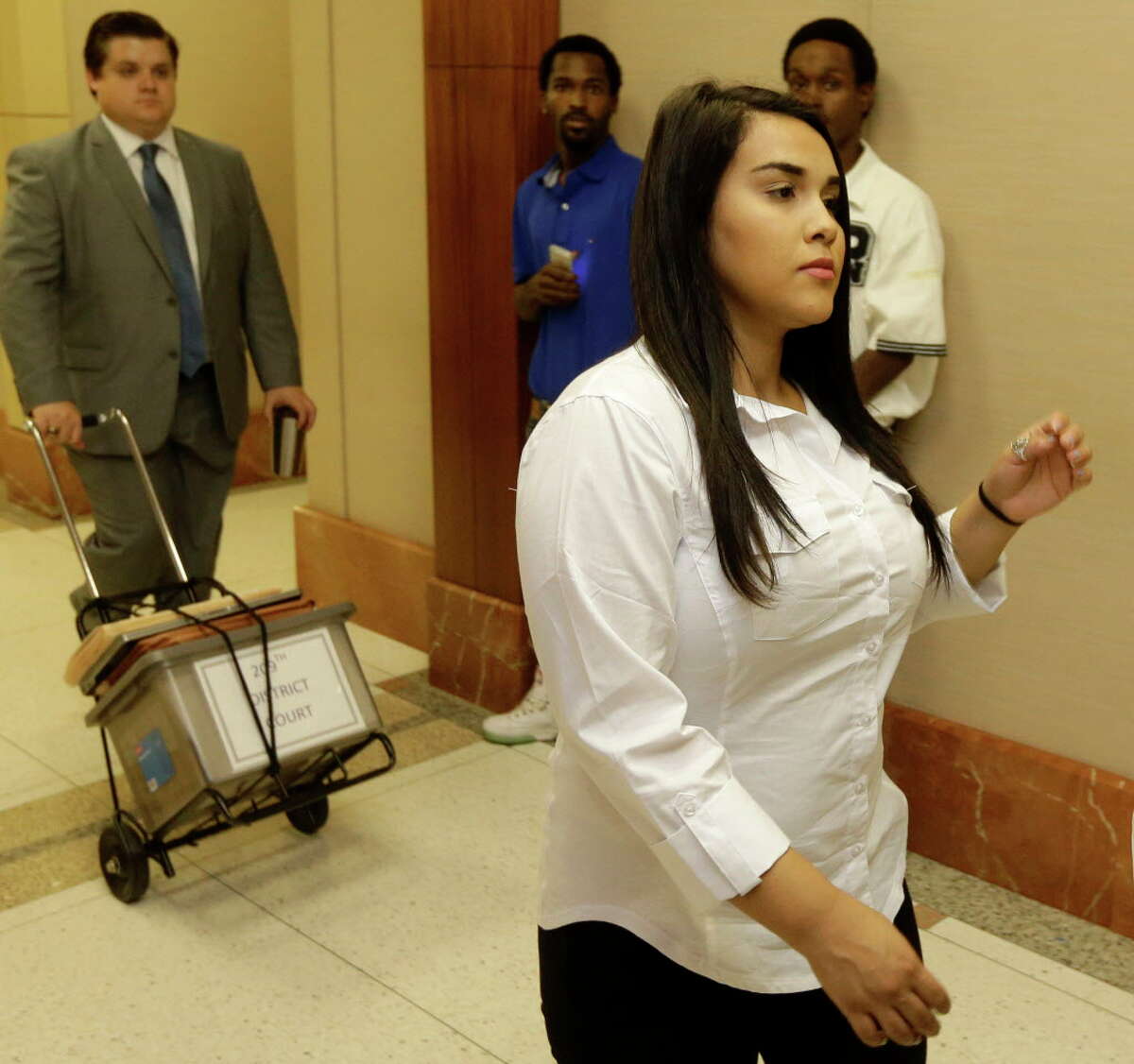 Alexandria Vera, 24, a former Aldine ISD teacher, arrives for court Wednesday, Aug. 3, 2016, in Houston. She is accused of having a long-term sexual relationship with a 13-year-old boy. State District Judge Michael McSpadden rejected a request from prosecutors that Vera's bail be revoked for a curfew violation. Vera is free on a $100,000 bail but has to wear a GPS ankle monitor, stay away from schools and have no contact with the teen who allegedly impregnated her.