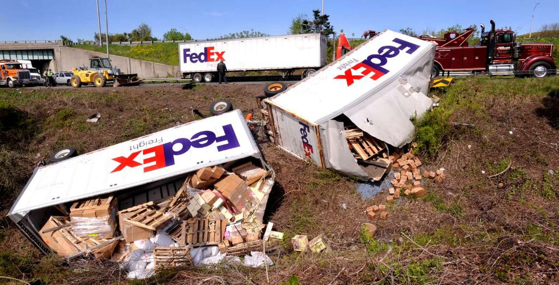 FedEx truck tumbles off I-84 in Danbury