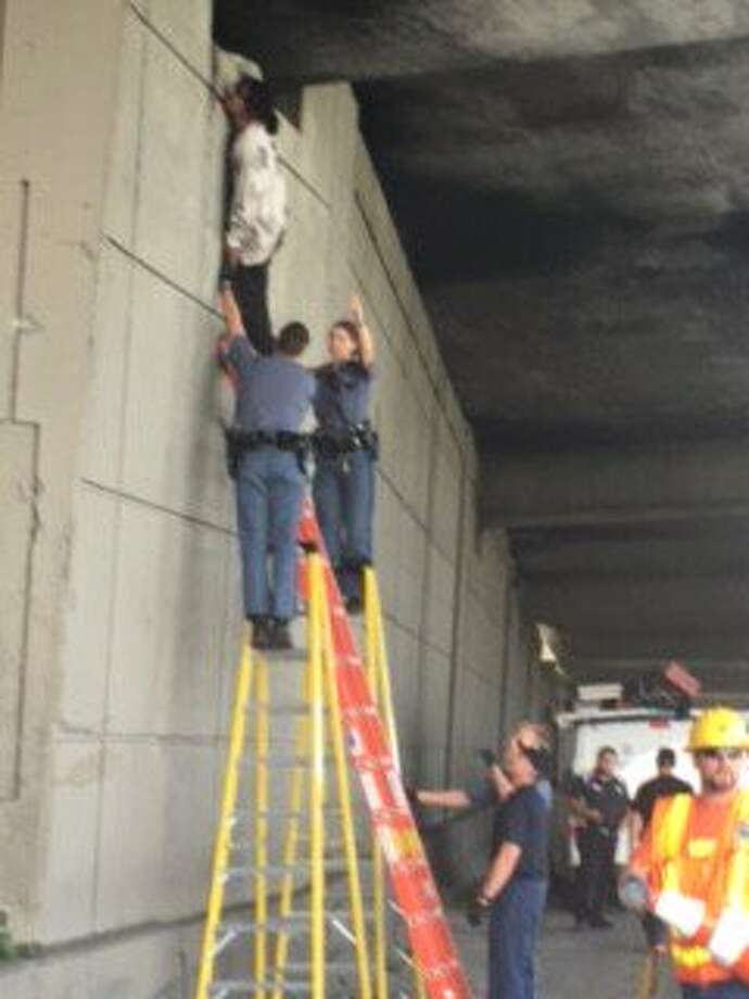 Witnesses help first responders rescue man hanging from I90 bridge in