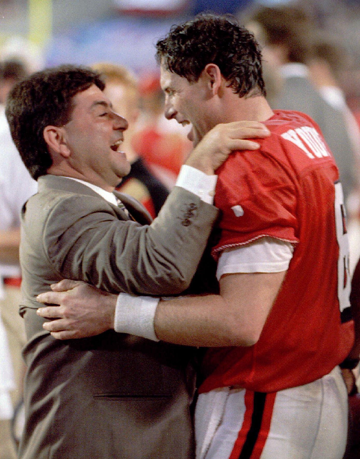 FILE - San Francisco 49ers quarterback Steve Young upends Dallas Cowboys  cornerback Deion Sanders after Sanders intercepted Young in the first  quarter of their Sunday, Nov 2, 1997, game in San Francisco.