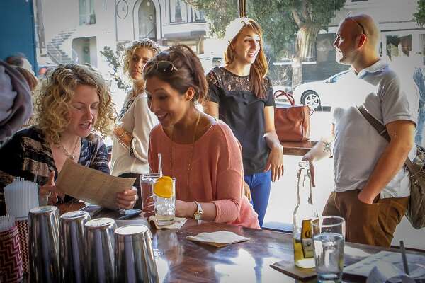 People have drinks at the bar at Padrecito in San Francisco , Calif., on Friday, June 14th, 2013.