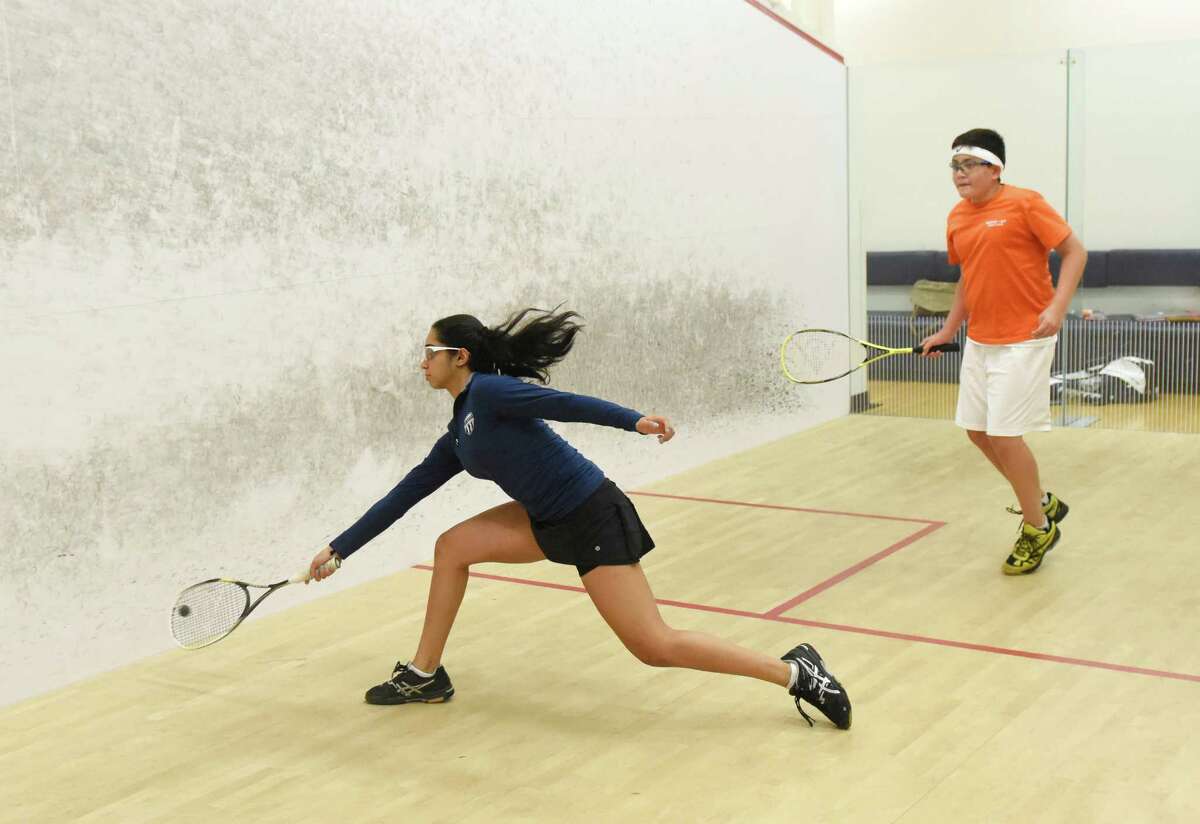 Greenwich's Prianca Patel, 15, and Alexander Garces, 12, of the Bronx, N.Y., practice squash at the New York Sports Clubs squash courts in Stamford on Wednesday.
