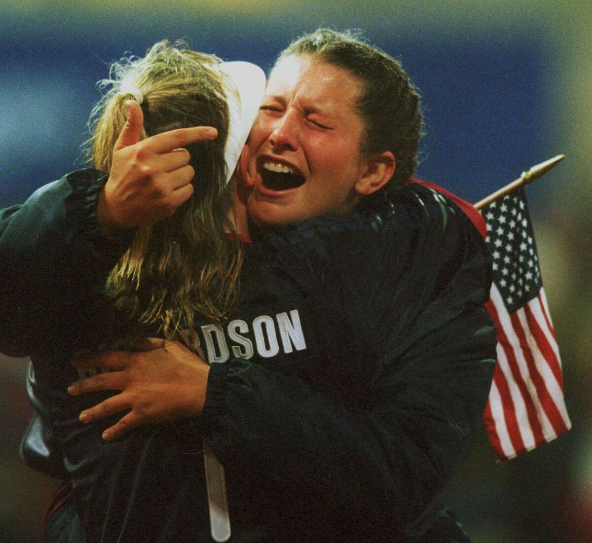 Christa Williams, hugging teammmate Dot Richardson after the US defeated Japan 2-1 in 8 innings to win the gold medal in Sydney, was nominated for the Texas Sports Hall of Fame.