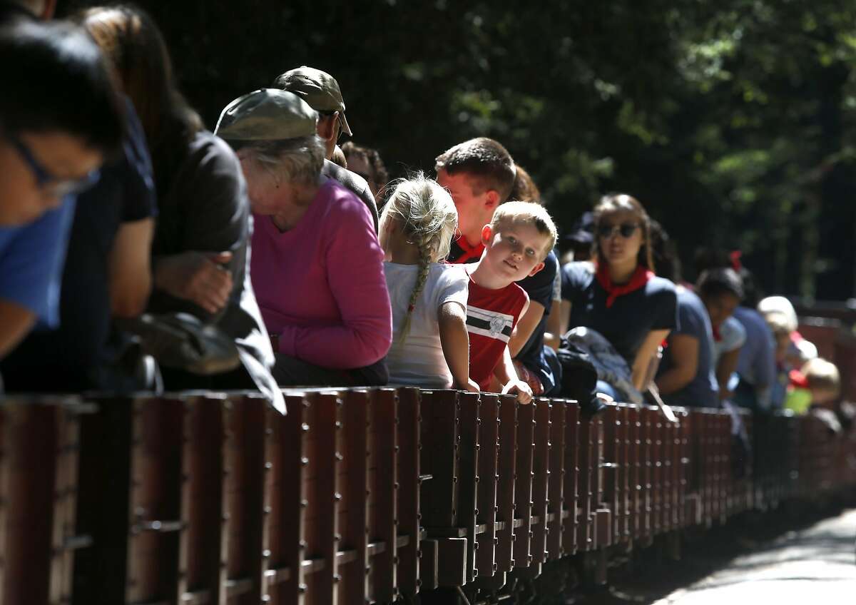 Passengers take their seats for a 1.2 mile ride through Tilden Park aboard the Redwood Valley Railway in Orinda, Calif. on Wednesday, Aug. 3, 2016.