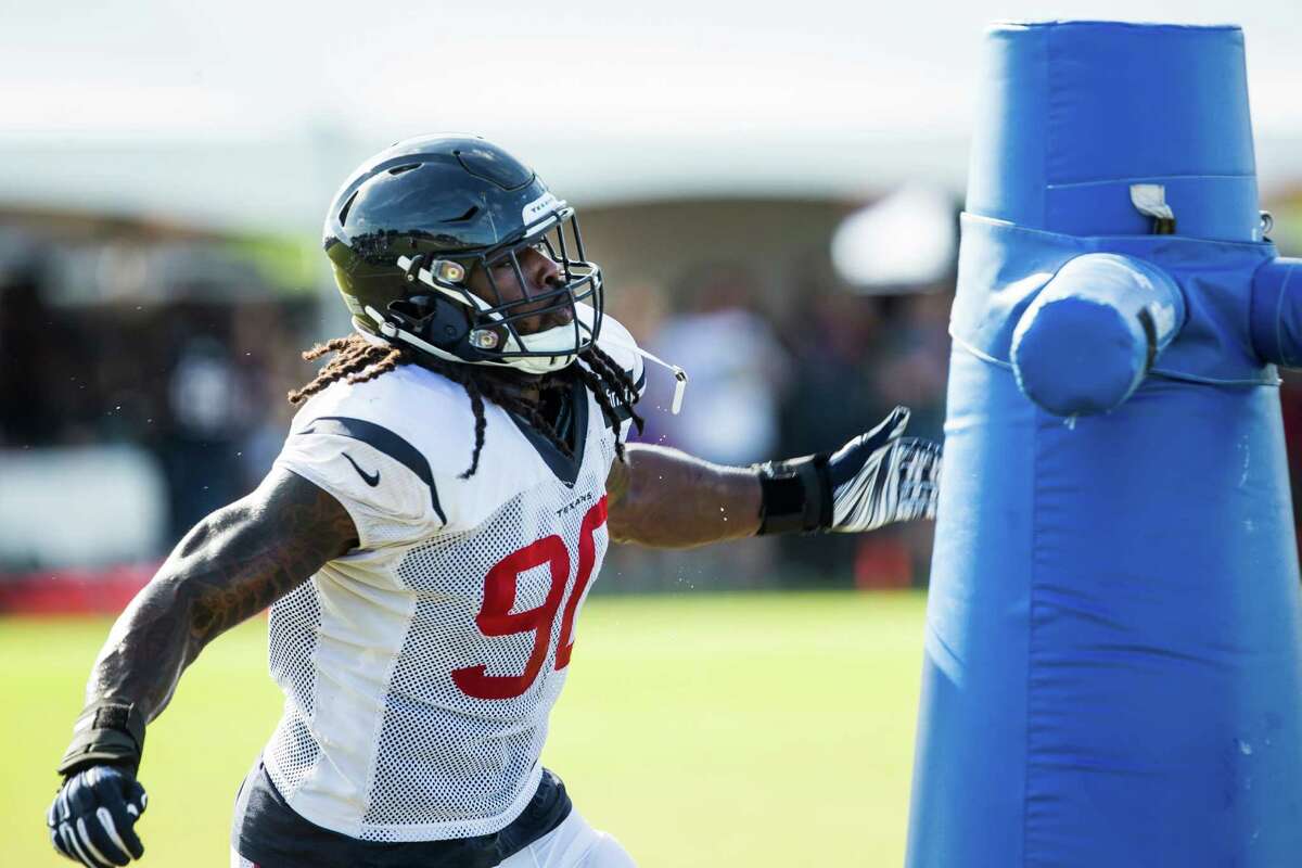 Houston Texans outside linebacker Jadeveon Clowney hits a blocking dummy during a pass rush drill during Texans training camp at Houston Methodist Training Center on Thursday, Aug. 4, 2016, in Houston.