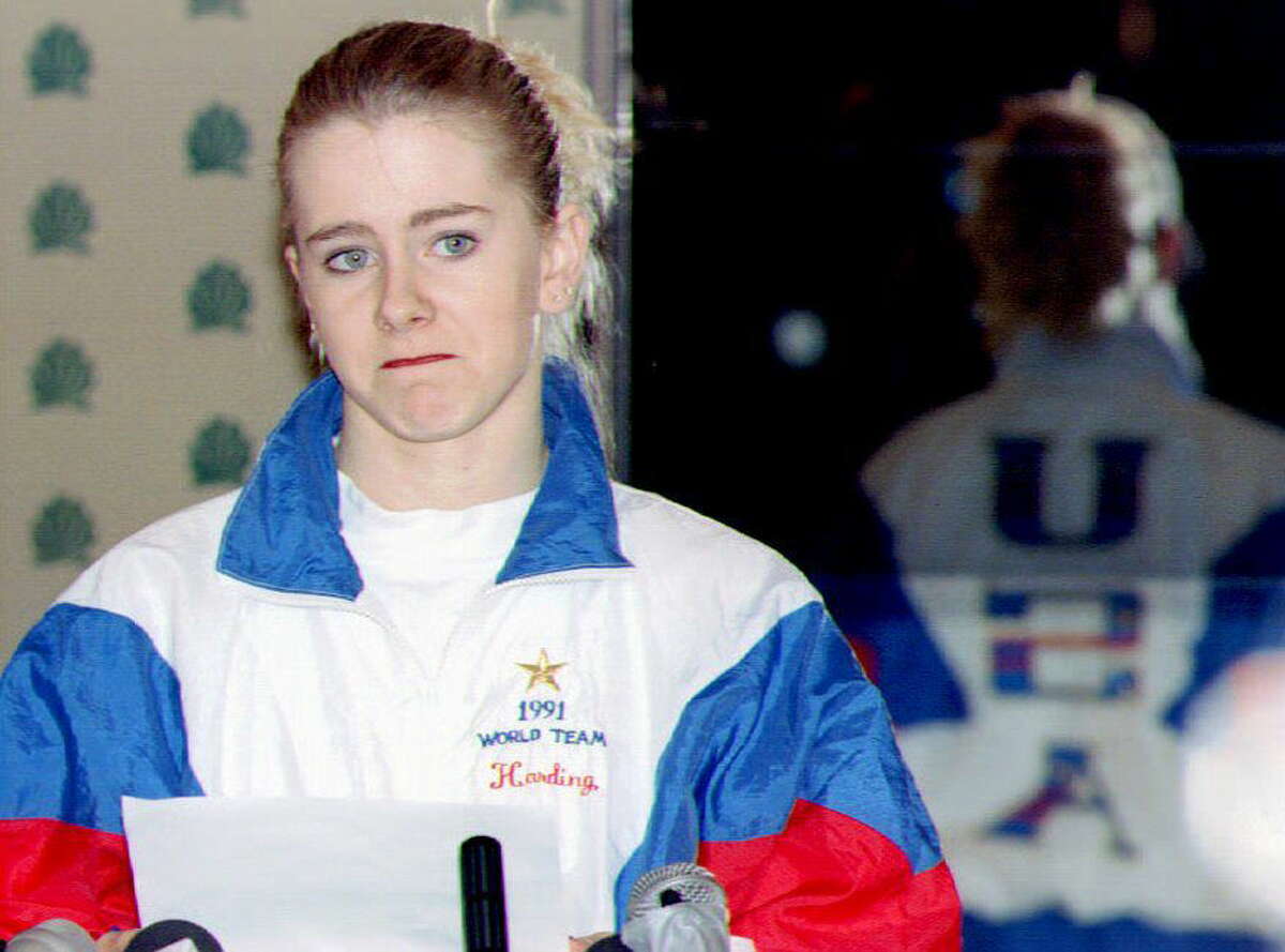 U.S. figure skater Tonya Harding reads from a prepared text January 27, 1994 during a press conference at the Multnomah County Athletic Club, Oregon. Harding admitted that she failed to tell authorities what she knew about the attack on fellow skater Nancy Kerrigan. Harding also denied planning to injure Kerrigan and asked to remain on the U.S. Olympic team.