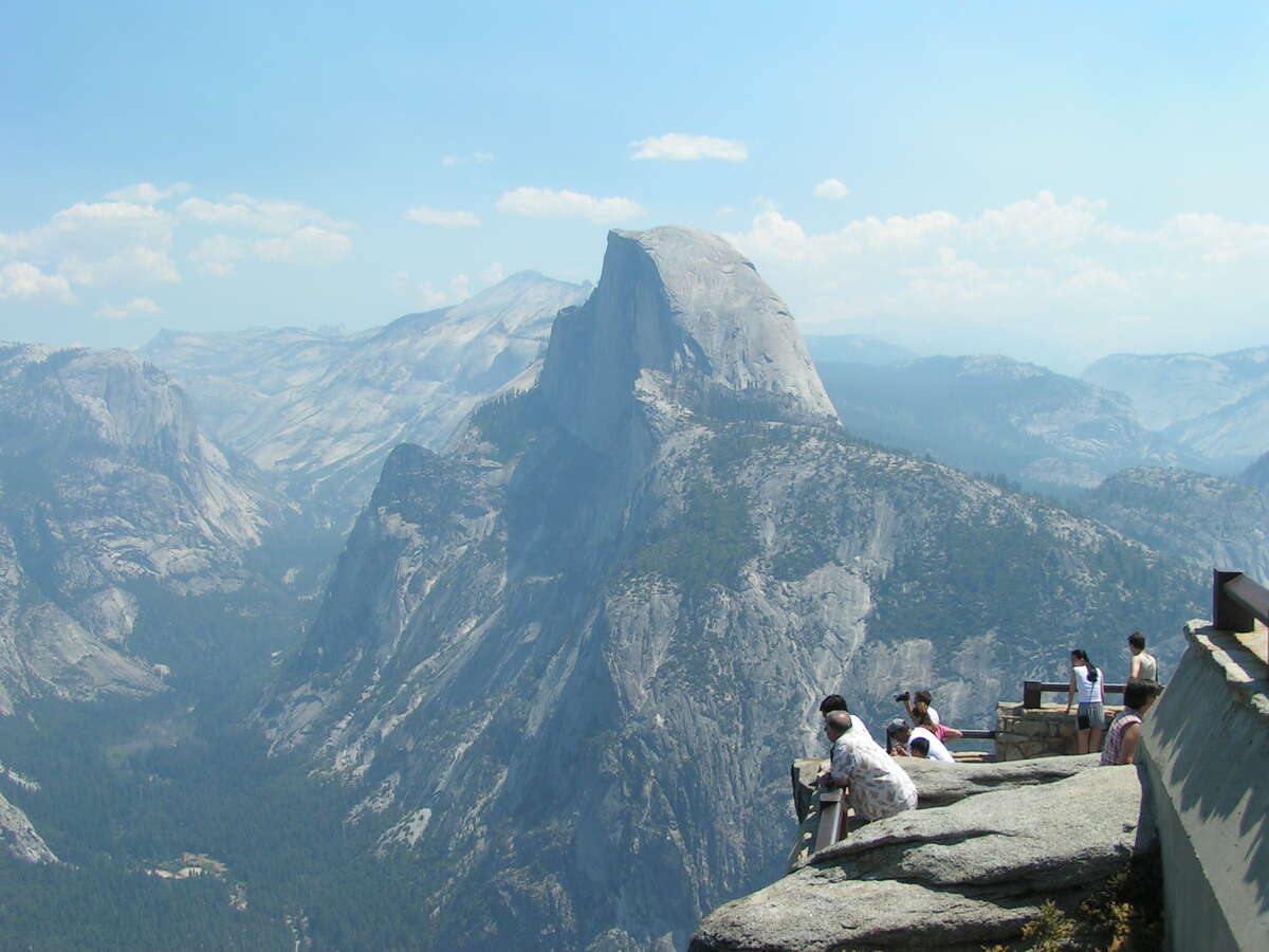 Visitors take in the majestic views at an overlook at Yosemite National Park.