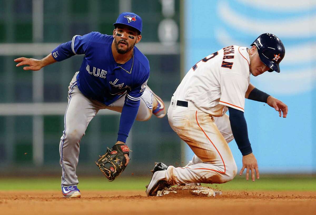 One of the Astros' rare rallies was snuffed out in the sixth when Blue Jays second baseman Devon Travis, left, gets Alex Bregman at second as part of an inning-ending double play Thursday night at Minute Maid Park.