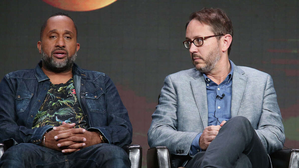 BEVERLY HILLS, CA - AUGUST 04: (L-R) After a TCA panel on 'Black-ish,' creator/executive producer Kenya Barris revealed his love for S.A.'s Spurs. Next to him is executive producer Jonathan Groff. (Photo by Frederick M. Brown/Getty Images)