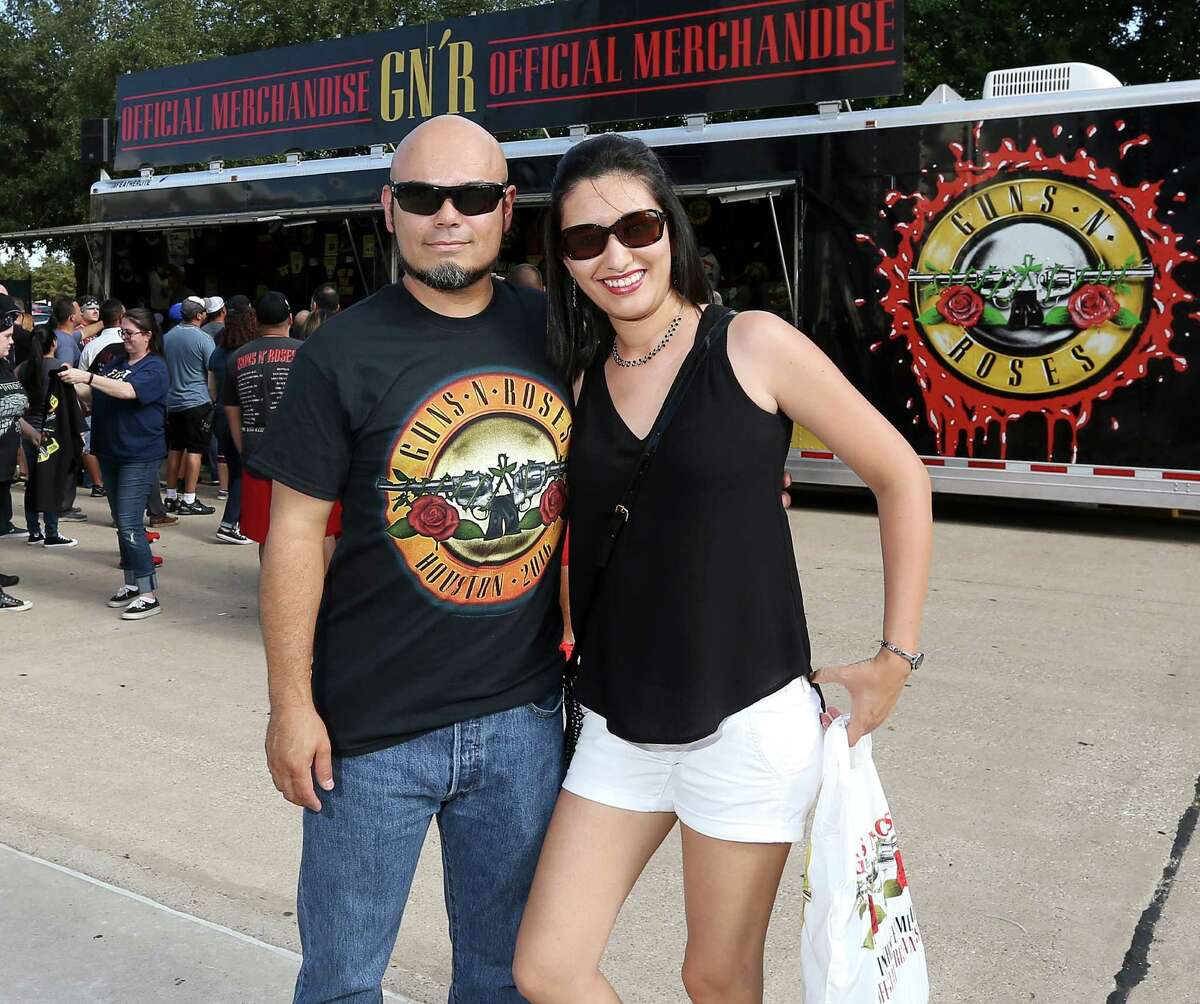 People pose for a photo before the Guns N' Roses concert at NRG Stadium, Friday, Aug. 5, 2016, in Houston.