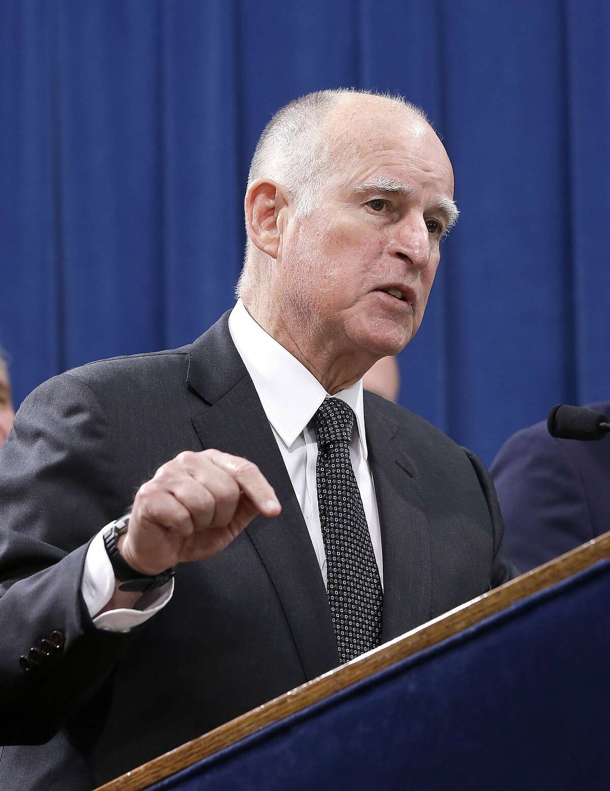 FILE -- In this March 28, 2016 file photo is California Gov. Jerry Brown at a news conference in Sacramento. On July 1, 2016 Governor Brown singed six gun control bills that make it harder to buy ammunition and barring magazine clips that hold more than 10 rounds.