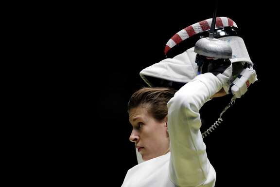 The Hurley sisters, who are from San Antonio but train in Houston, saw their dreams of ﻿individual Olympic gold medals end Saturday when Kelley, left, lost to Nathalie Moellhausen of Brazil and an unmasked Courtney, right, fell to Yana Shemyakina of Ukraine in the women's epee round of 32.