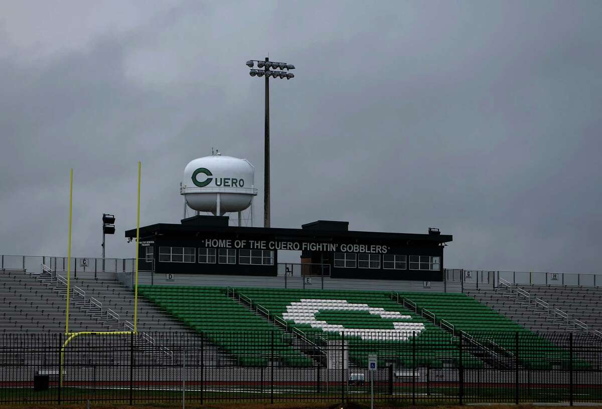 "Home of the Cuero Fightin' Gobblers" reads the words atop the football stadium on the north side of Cuero, Tuesday, July 26, 2016, in Cuero. Cuero was a stop on the Chisolm Trail in the mid-1800s, and was formerly incorporated in 1873 when the railroad was extended through the area. In recent years the town saw a resurgence with the drilling in the Eagle Ford shale fields before the recent decline in production decimated the burgeoning work force. DeWitt County remains the second largest oil producer in the state but the workforce has been decimated, according to recent industry figures. At the beginning of 2015 there were 27 rigs, each with roughly 100 jobs attached. By the start of 2016 it had slipped to 13. Today there are three. ( Mark Mulligan / Houston Chronicle )