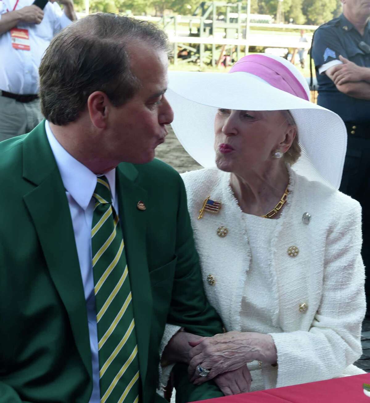 John Hendricksen gives a smooch to his wife Marylou Whitney on the occasion of the celebration of her 90th birthday on the day of the 89th running of The Whitney on Frosted Aug. 6, 2016 in Saratoga Springs, N.Y. T (Skip Dickstein/Times Union