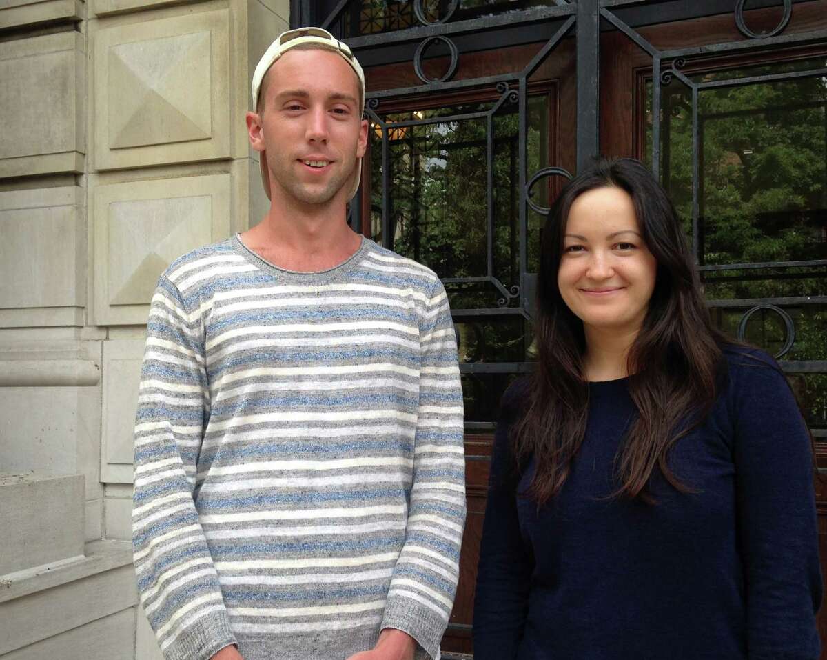 In this Aug. 2, 2016 photo, Ian Bradley-Perrin, left, and fellow graduate student Olga Brudastova, pose for a photo on the campus of Columbia University in New York. Both are active in the campaign to unionize grad students who work as teaching and research assistants at Columbia. (AP Photo/Karen Matthews) ORG XMIT: NYR301