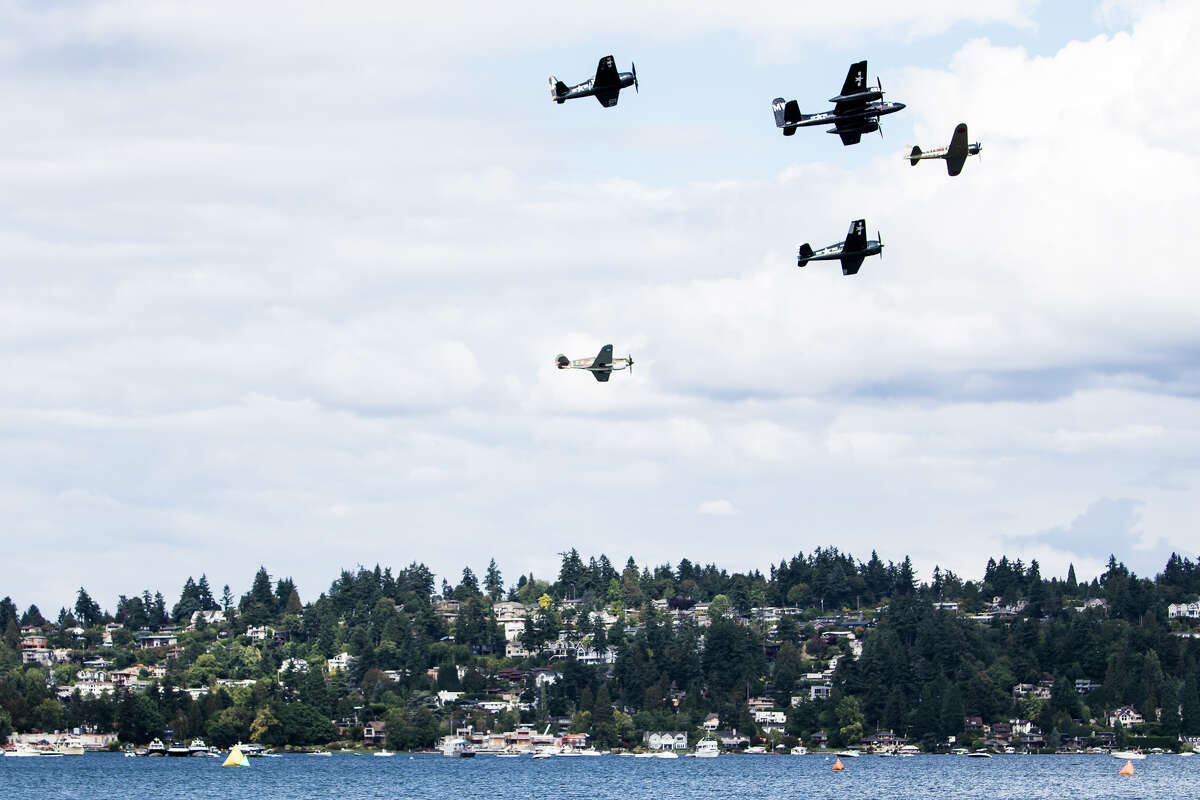 A group of historic planes passes over Lake Wasington during day three of Seafair on Sunday, Aug. 7, 2016. (Lacey Young, seattlepi.com)