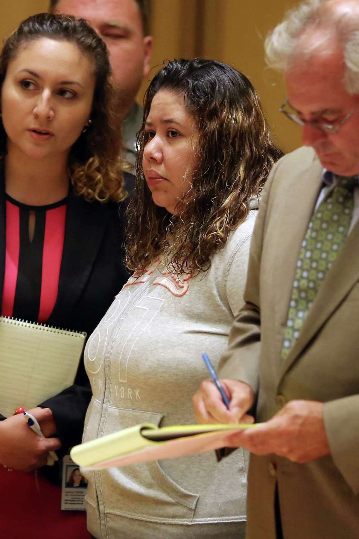 Nydia Carrillo-Maldonado stands in state Superior Court in Stamford as she is arraigned on first-degree manslaughter and risk of injury to a minor charges on Tuesday. Carrillo-Maldonado was the owner of Little Bears Beginnings Daycare, where a 2-month-old toddler died last month.