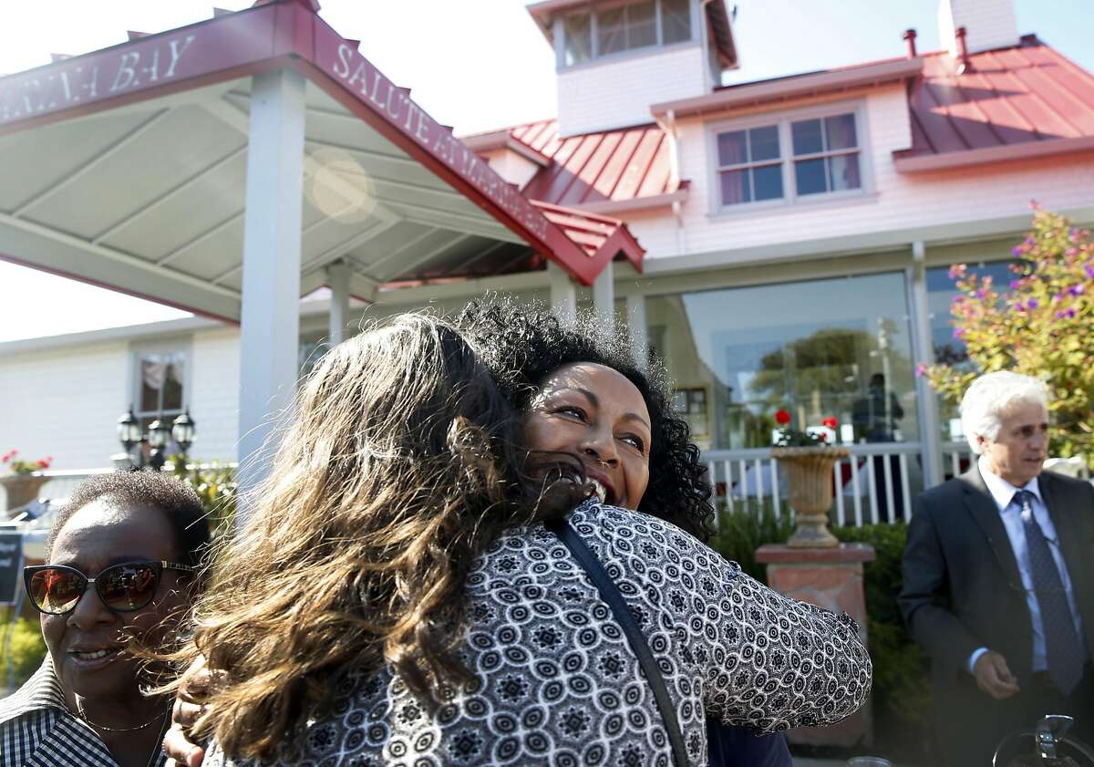 FILE – Restaurateur Menbere Aklilu (center) hugs one of the many supporters attending a rally at her Salute e Vita restaurant in Richmond in this 2016 file photo. The popular restaurant and its philanthropic owner Menbere Aklilu were issued a 30-day eviction notice by the property's landowner, which is sparking outrage throughout the community.