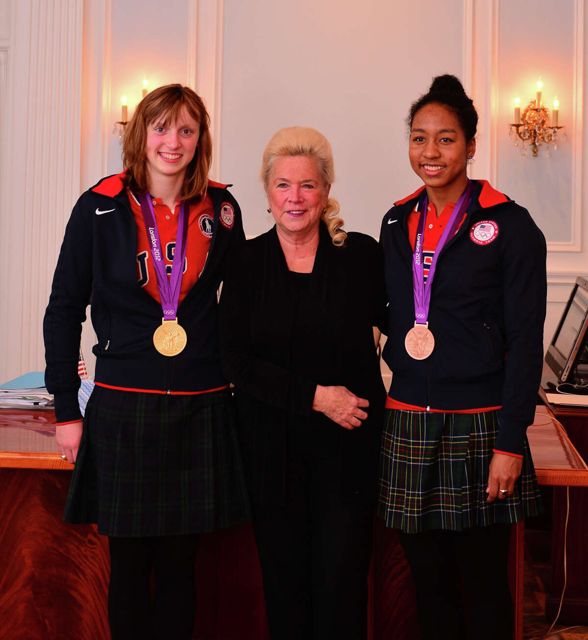 Olympians Katie Ledecky (L) and Lia Neal (R) posed with Head of School Pamela Juan Hayes at Sacred Heart Greenwich in 2013.