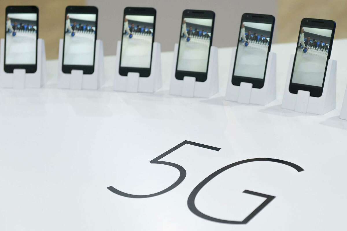 Mobile phones with 5G are displayed at the Mobile World Congress in Barcelona, Spain, in February. The rollout of these devices have renewed health concerns.
