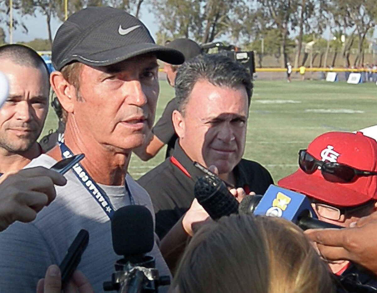 Former Baylor football coach Art Briles talks with the media after attending the Dallas Cowboys' afternoon practice during training camp in Oxnard, Calif., on Tuesday, Aug. 9, 2016.