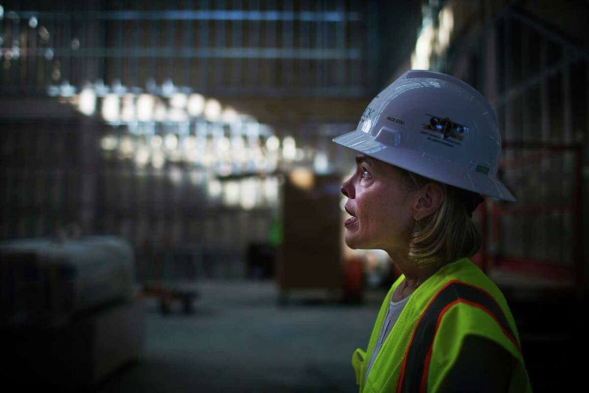 Alison Weaver, executive director of the Moody Center for the Arts, tours the center during construction. Houston Chronicle )