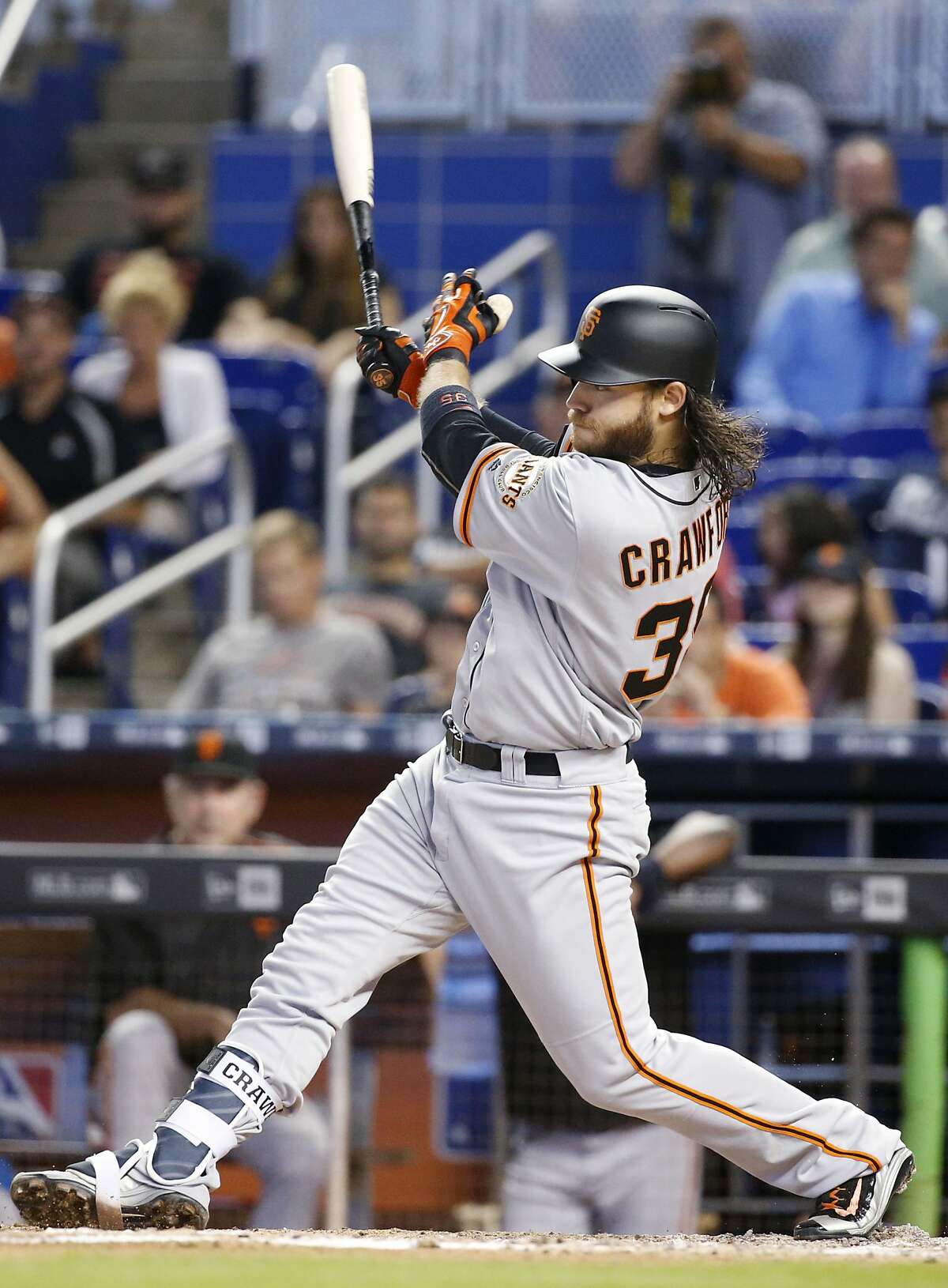 San Francisco Giants' Brandon Crawford hits a home run during the fourth inning of a baseball game against the Miami Marlins, Wednesday, Aug. 10, 2016, in Miami. The Giants defeated the Marlins 1-0. (AP Photo/Wilfredo Lee)