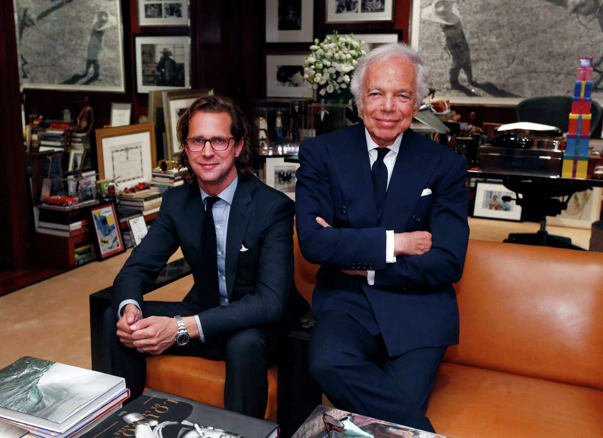 Designer Ralph Lauren (right) is shown in his office with CEO Stefan Larsson. Ralph Lauren swung to a first-quarter loss after the company spent heavily to turn itself around, but the damage was not as bad as many had expected.