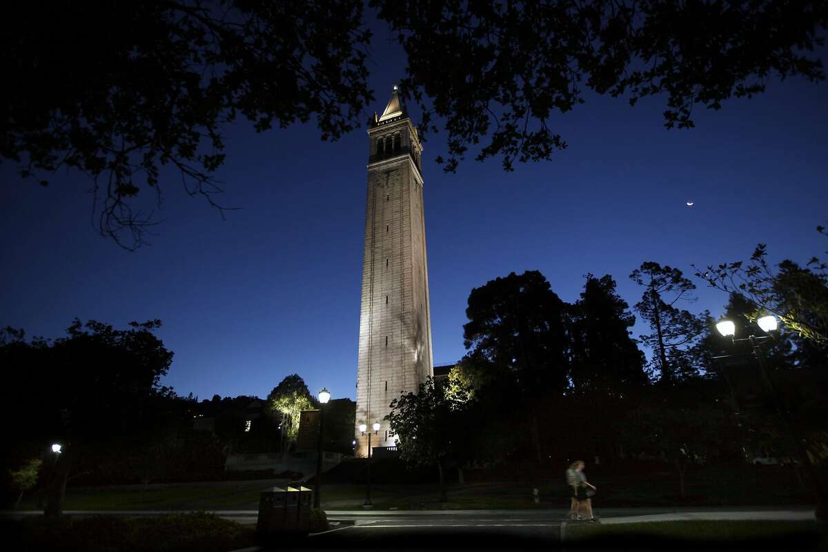 Early morning joggers pass the Campanile on the campus of the University of California at Berkeley, in a September 2015 file image. School administrators are leading an ambitious effort to reshape the nation's premier public research institution, but they are facing increasingly fierce reactions from their usual allies -- the faculty. (Bob Chamberlin/Los Angeles Times/TNS)