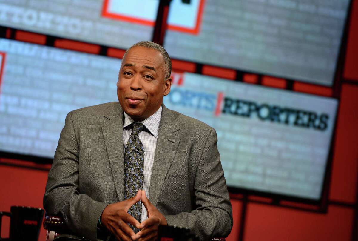 In this May 12, 2013 photo provided by ESPN Images. John Saunders poses on the set of "The Sports Reporters" in Studio A in Bristol, Conn. Saunders, who has hosted "The Sports Reporters" for the last 15 years, has died, the ESPN announced Wednesday, Aug. 10, 2016. He was 61. (Joe Faraoni/ESPN Images via AP) ORG XMIT: NY158