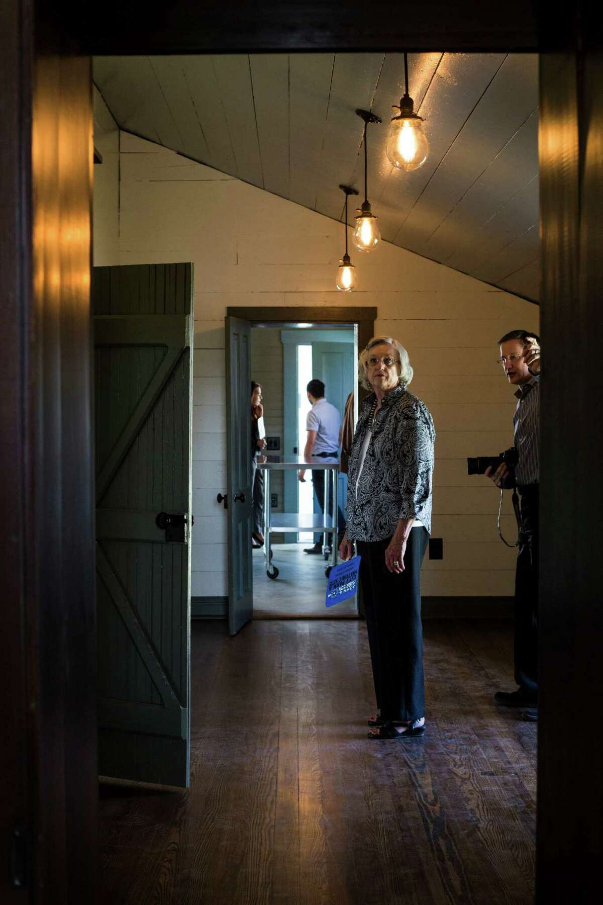 Carol Carpenter studies the room as her son, Scott Carpenter, shows her around during the public opening of the John S. Harrison House in Selma, on Wednesday, August 10, 2016. The house, built in 1852, is on the National Registry of Historic Places and was recently part of a $1.2 million restoration project. Scott of 7th Generation Design in San Antonio, was the architect on the project and it was his mother's first visit.