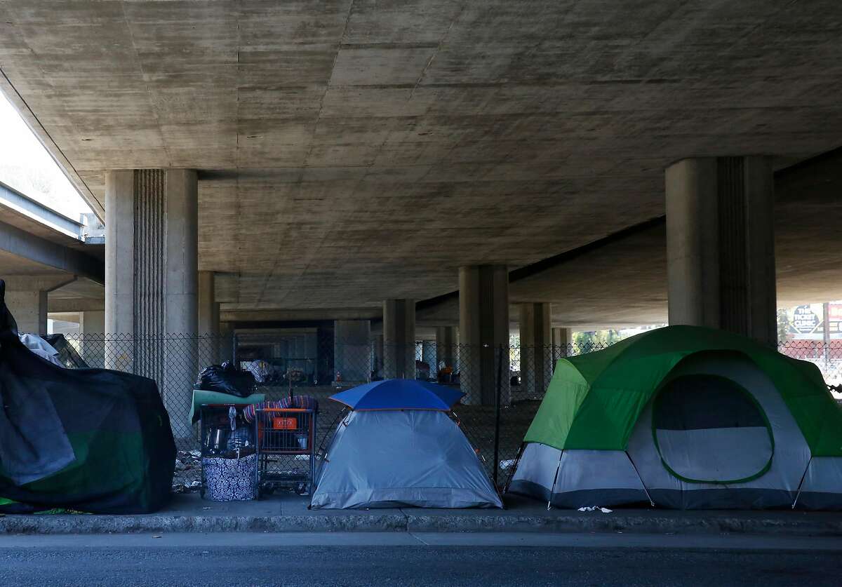 Tents can be seen underneath an overpass on Brush street Aug. 10, 2016 in Oakland, Calif.