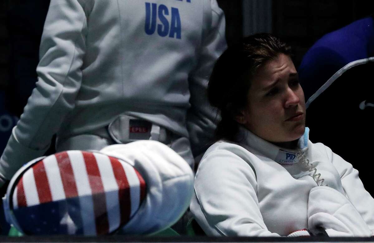 Courtney Hurley of the United States watches her teammates compete in a women's team fencing quarterfinal at the 2016 Summer Olympics in Rio de Janeiro, Brazil, Thursday, Aug. 11, 2016. (AP Photo/Andrew Medichini)