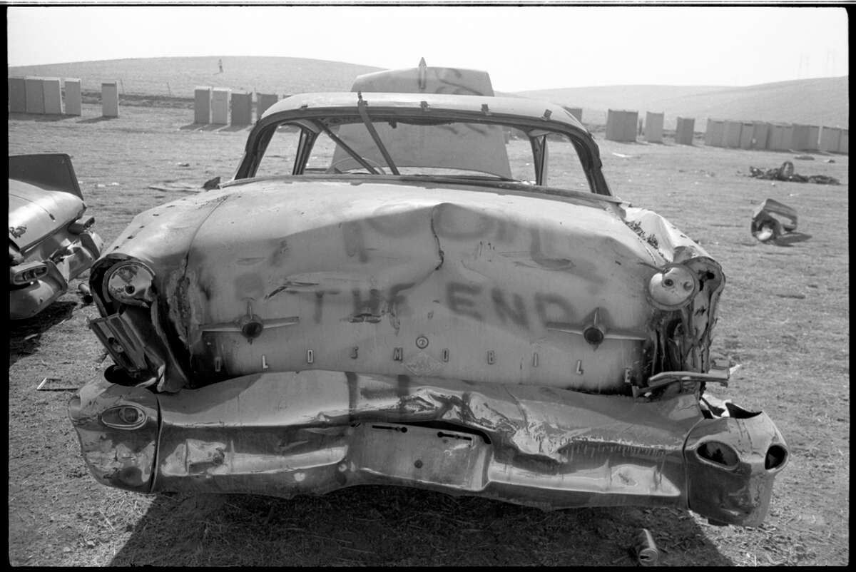 Damaged cars on the day after the Altamont concert.