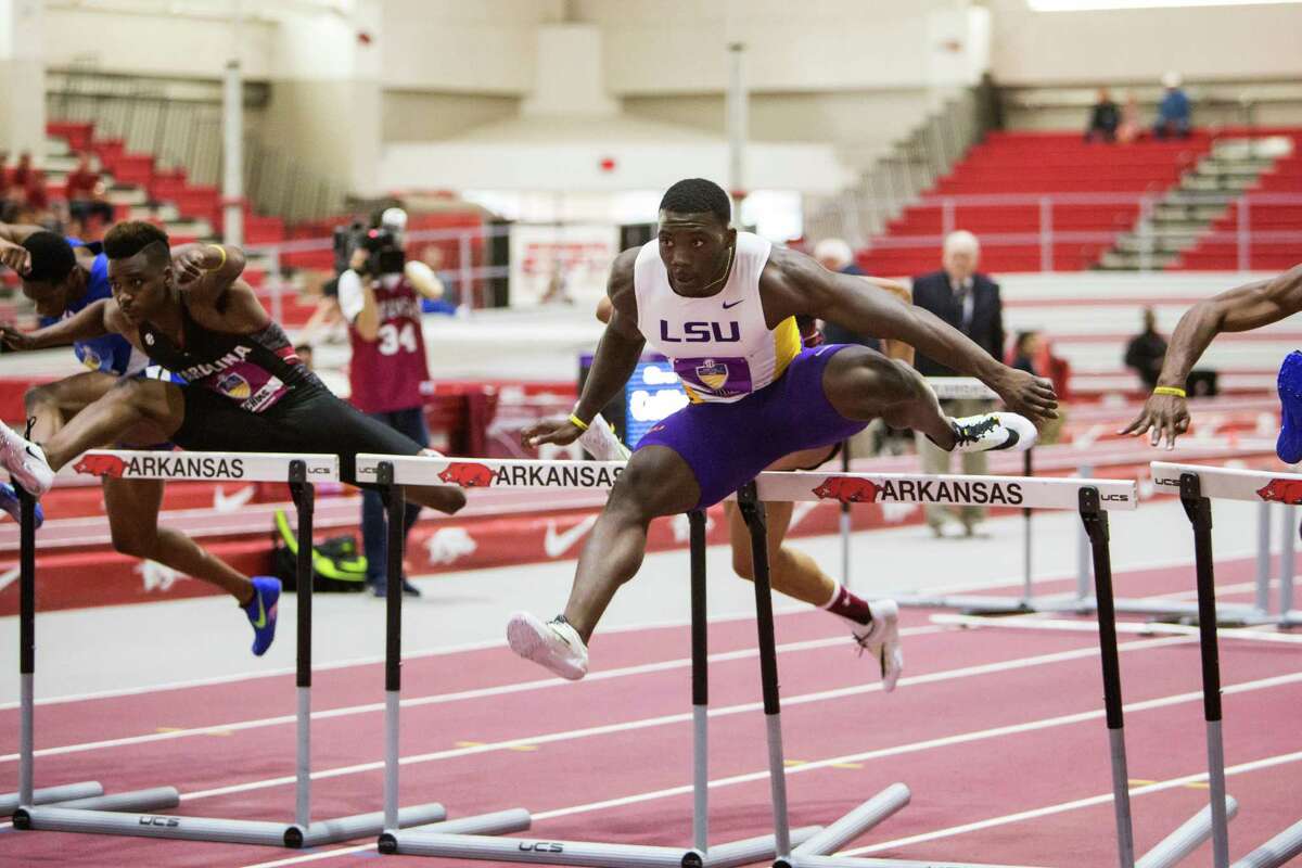 LSU’s Jordan Moore clears a hurdle in the 60-meter hurdles final during the Southeastern Conference indoor track and field championships on Feb. 27, 2016, in Fayetteville, Ark.