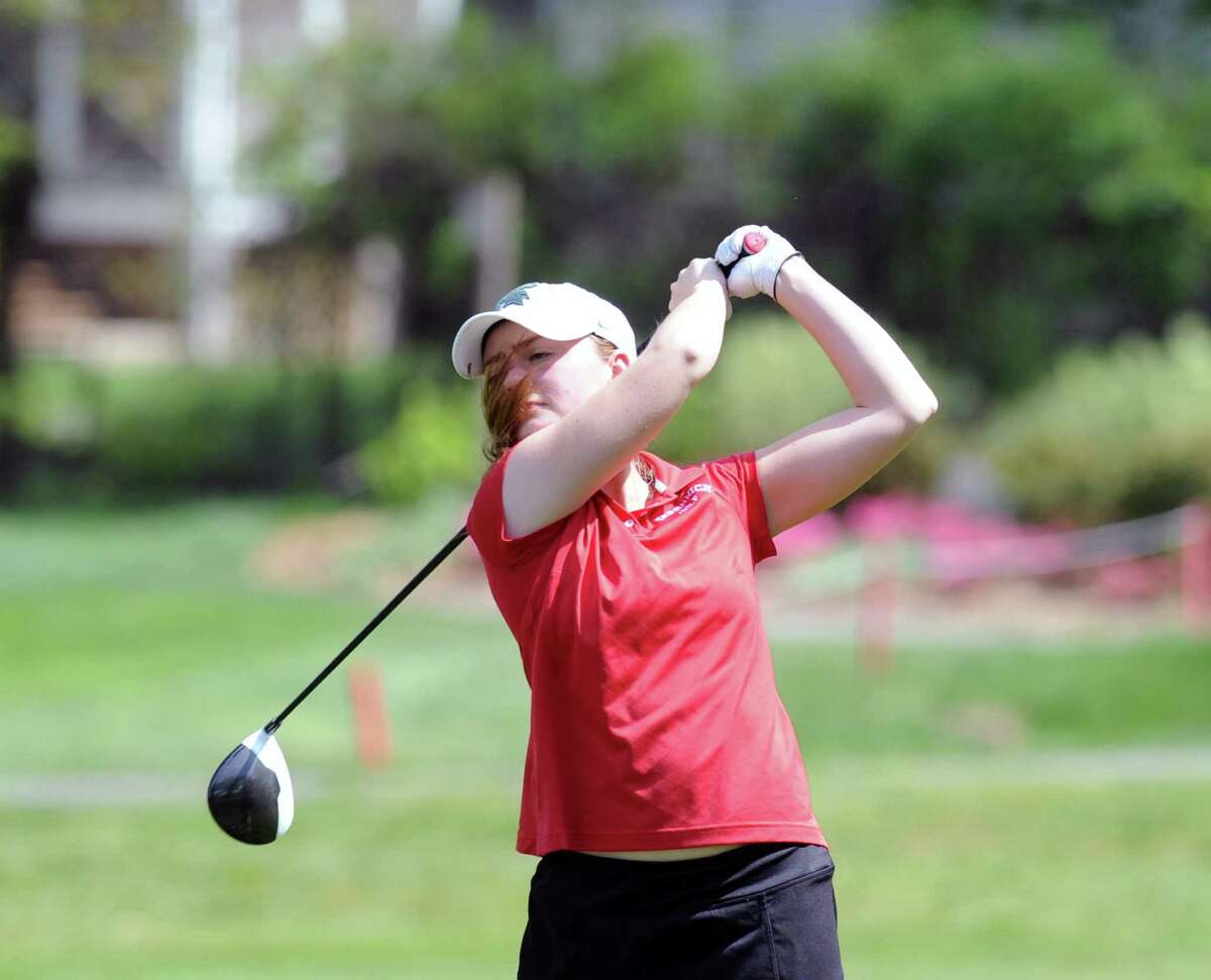 Catherine McEvoy, of Greenwich, drives off the first tee during a girls high school golf match in May.