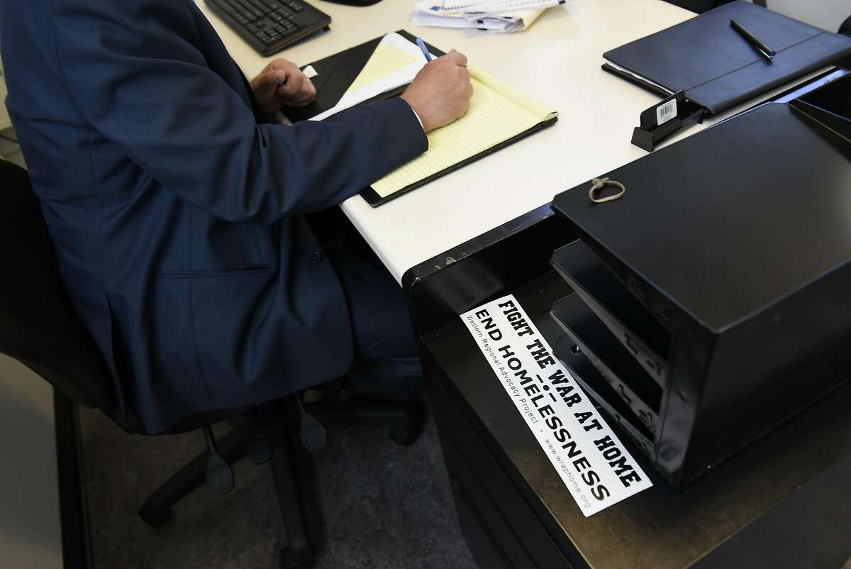 A bumper sticker sits on a desk nearJeff Kositsky, director of the Department of Homelessness and Supportive Housing, during his meeting with Leon Winston and Michael Blecker of Swords to Plowshares, at the DHSH offices in San Francisco, CA Thursday, August 11th, 2016.