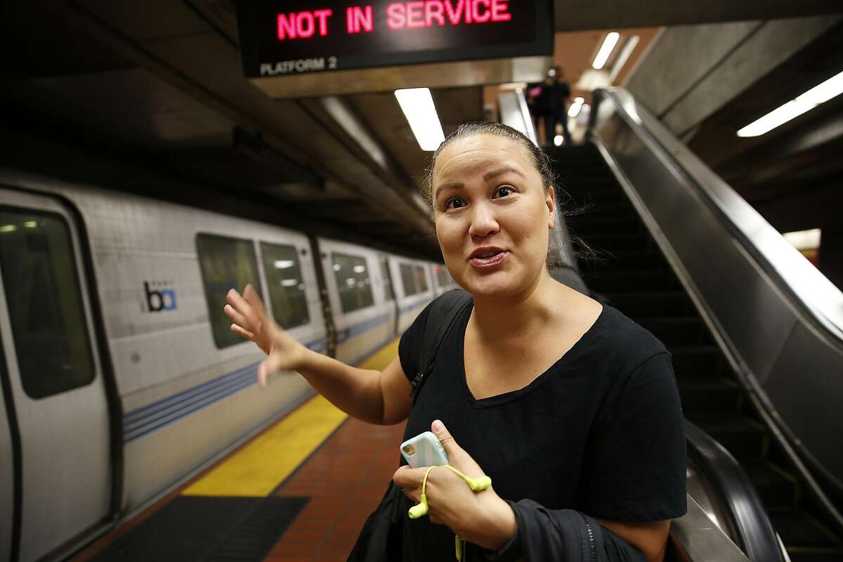 Sara Dobashi waits for a train bound for downtown to open doors at 24th St. Bart station on Friday, August 12, 2016, in San Francisco, Calif.