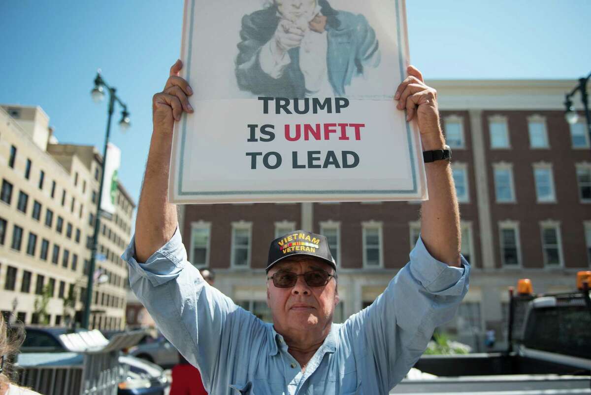 John Monaghan, a Vietnam War veteran, protests outside a campaign event for GOP presidential candidate Donald Trump in Portland, Maine. As the campaign heats up, so is the passion of our readers, whether for Trump or his opponent, Hillary Clinton.